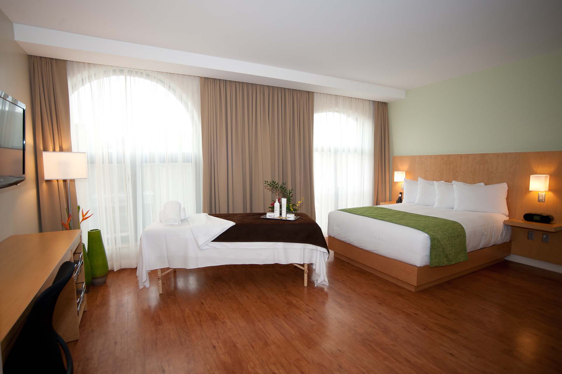 Accessible Queen room with a spa bed and work desk
