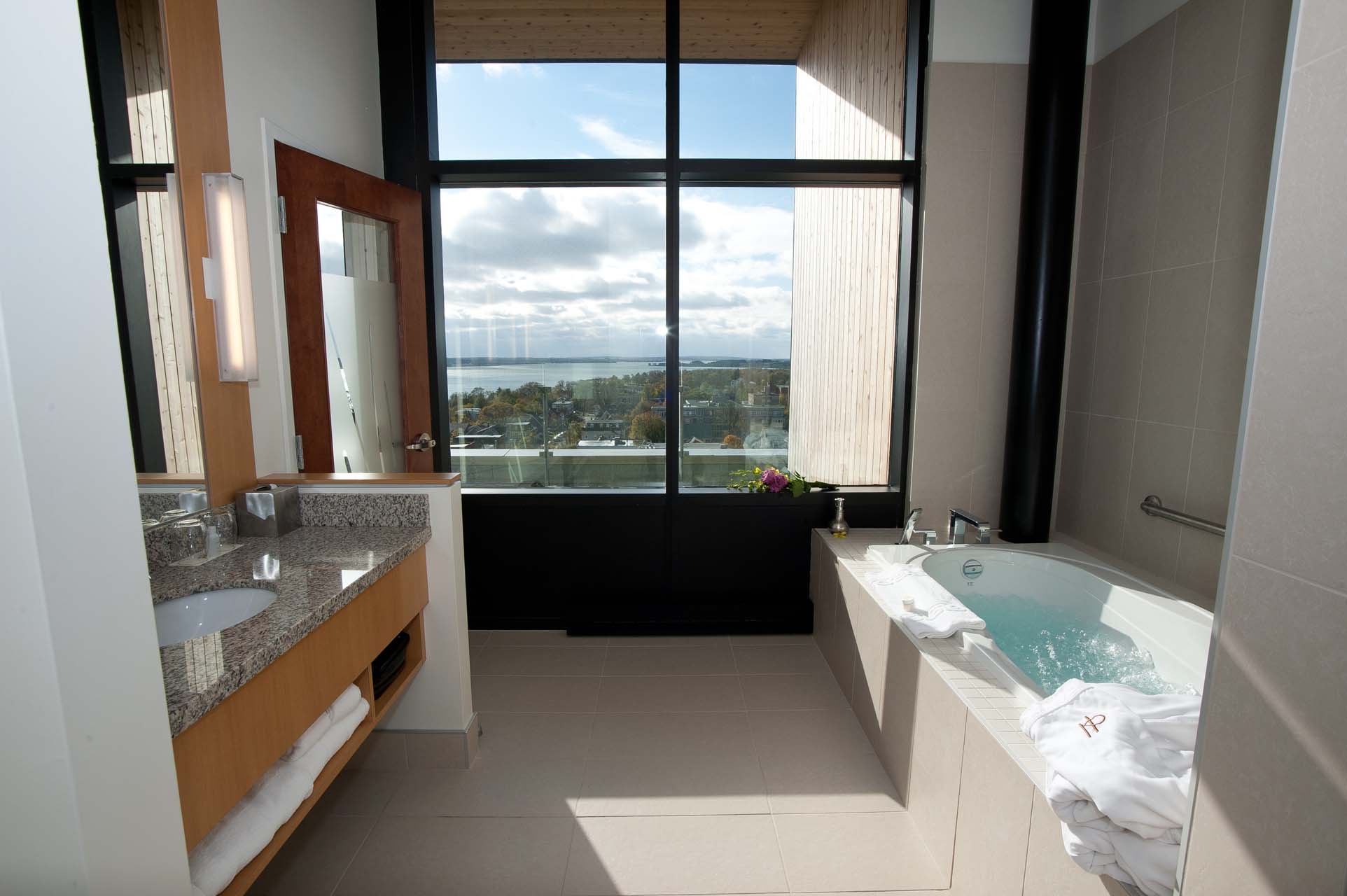 Bathroom with a tub and a single sink