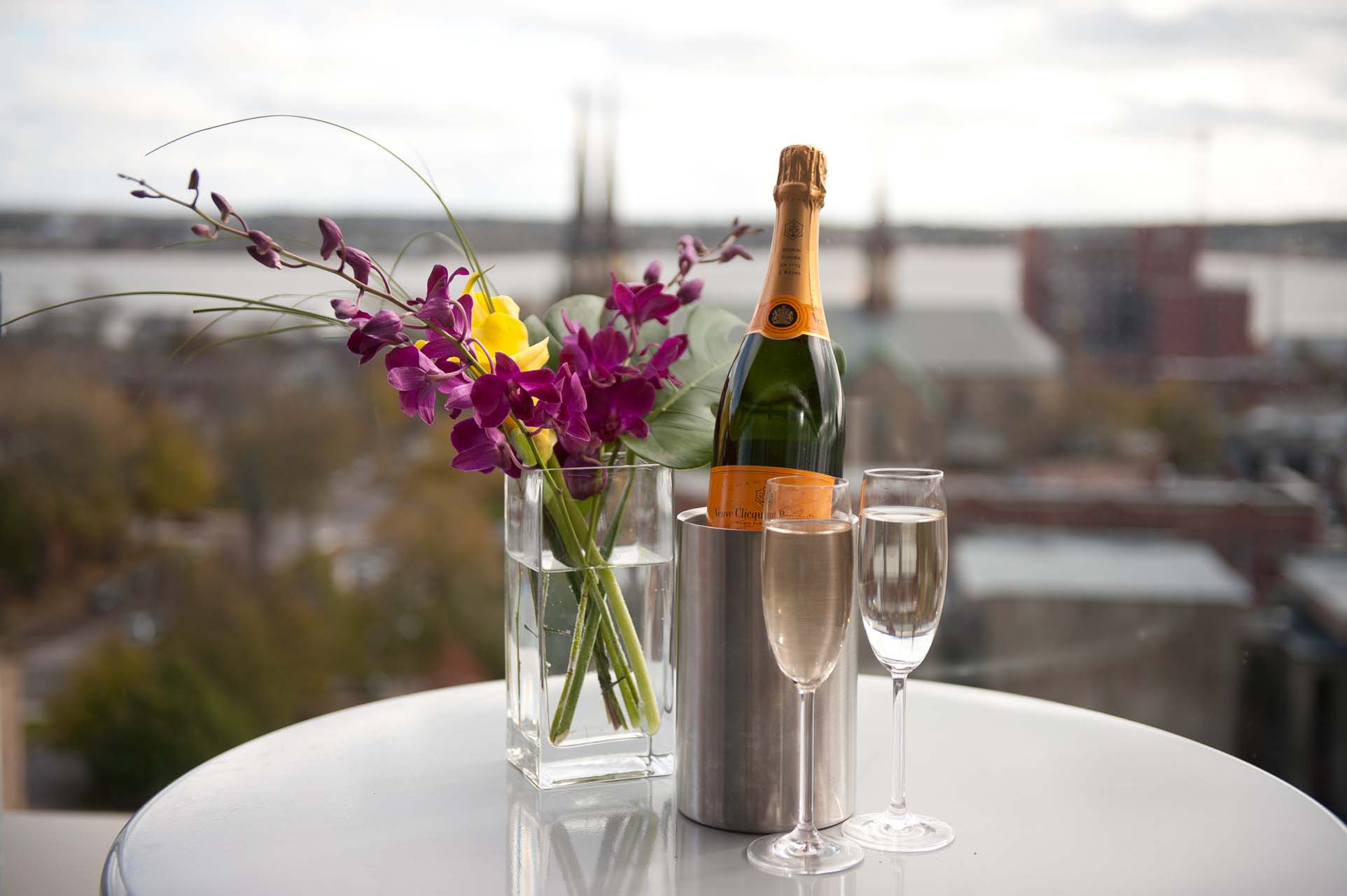 A glass of champagne with two glasses of wine