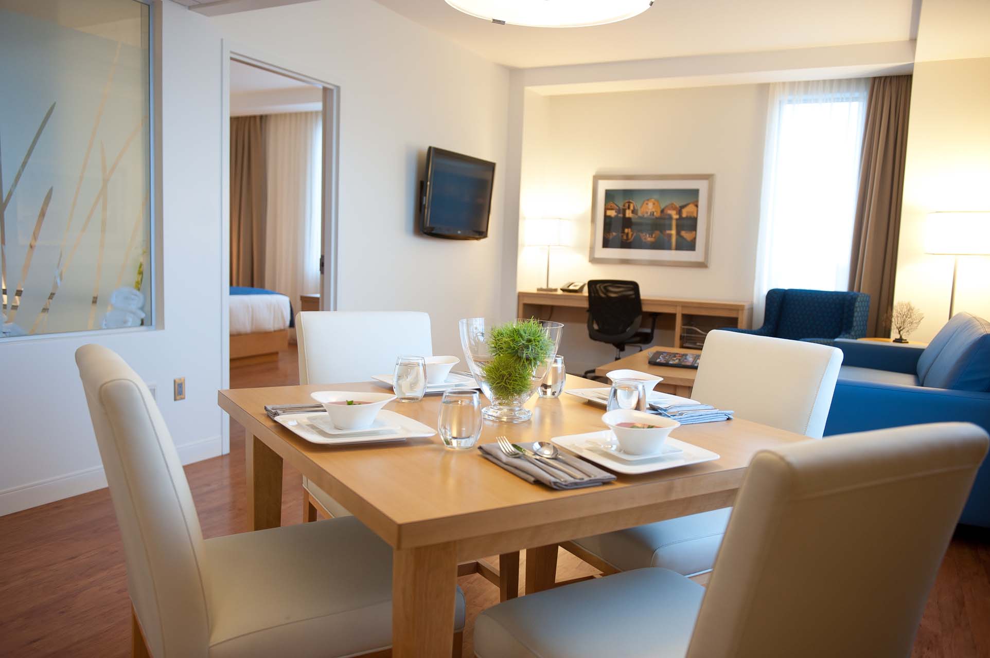 Dining room area with a living room in the background