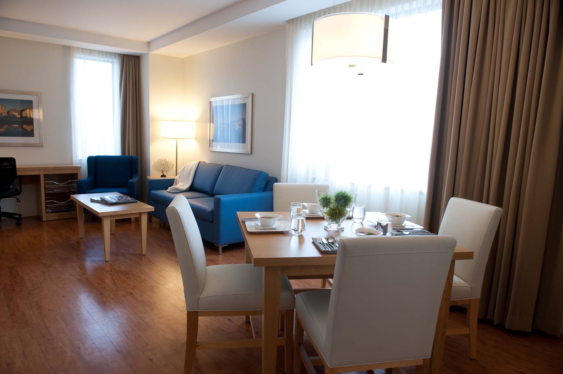 Living room with sofas and a dining room area