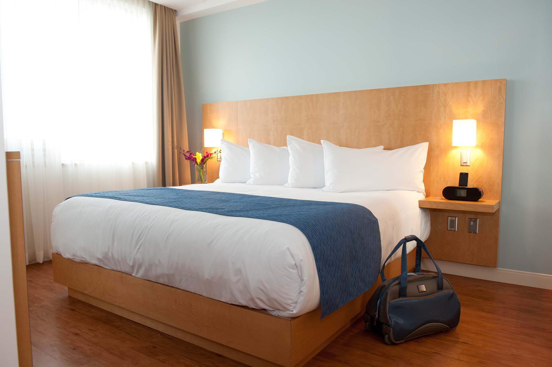 A bedroom with a king bed