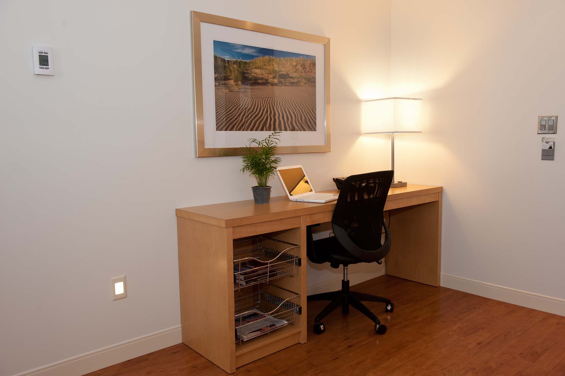 A work desk with a chair