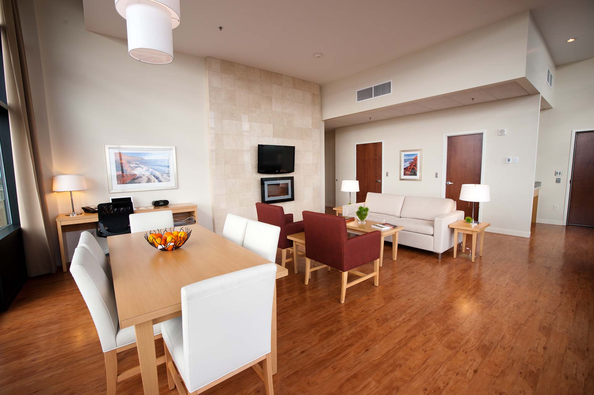 Living room space with a sofa and dining area