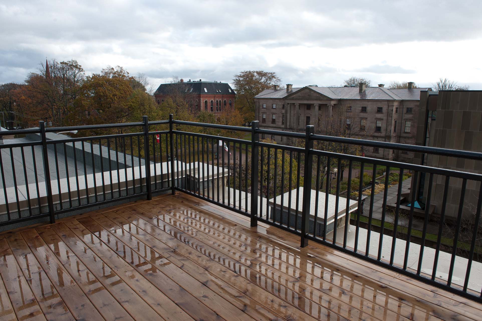 A large deck with a view of the city